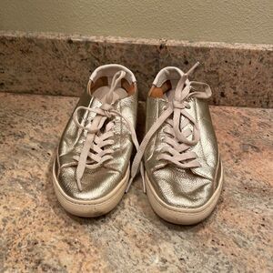 Soludos woman’s gold sparkly tennis shoes